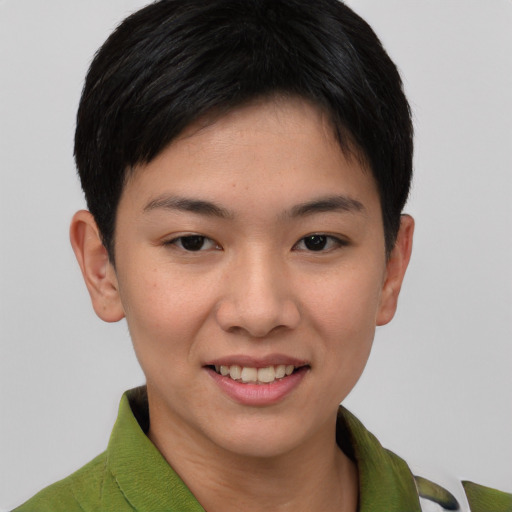 Joyful asian young-adult female with short  brown hair and brown eyes