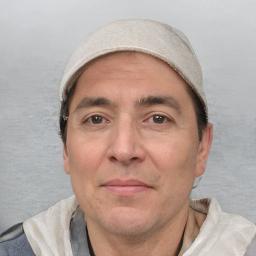 Joyful white adult male with short  black hair and brown eyes
