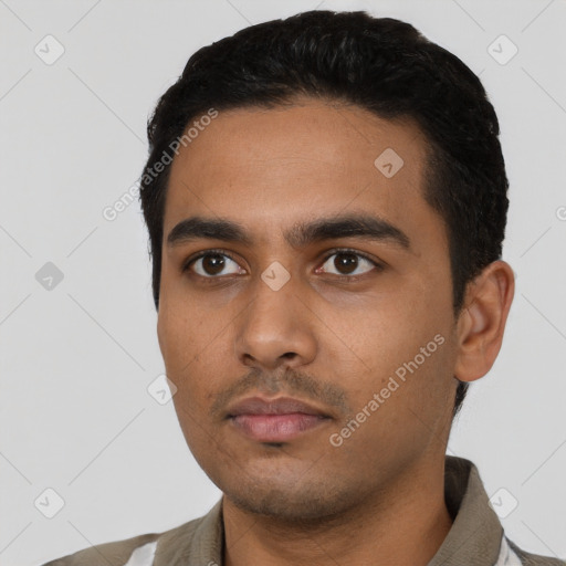 Neutral latino young-adult male with short  black hair and brown eyes