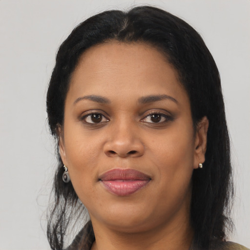 Joyful black young-adult female with medium  black hair and brown eyes