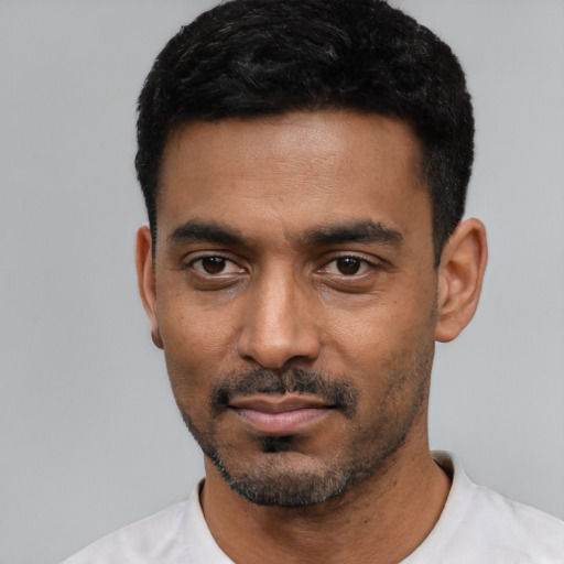 Neutral black young-adult male with short  black hair and brown eyes
