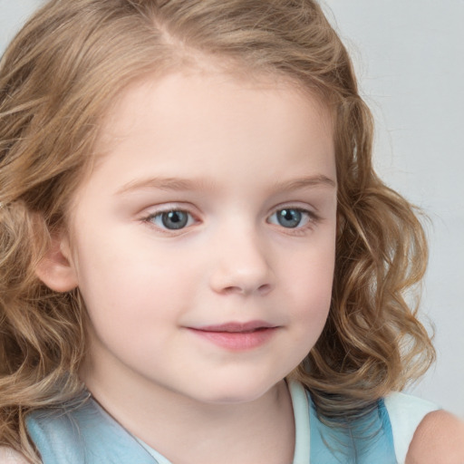 Joyful white child female with medium  brown hair and blue eyes