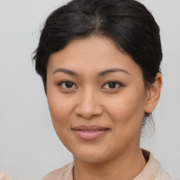 Joyful asian young-adult female with short  brown hair and brown eyes