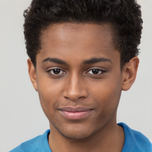 Joyful black young-adult male with short  brown hair and brown eyes