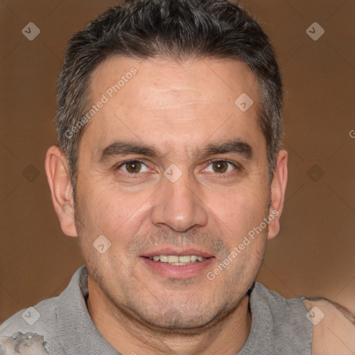 Joyful white adult male with short  brown hair and brown eyes