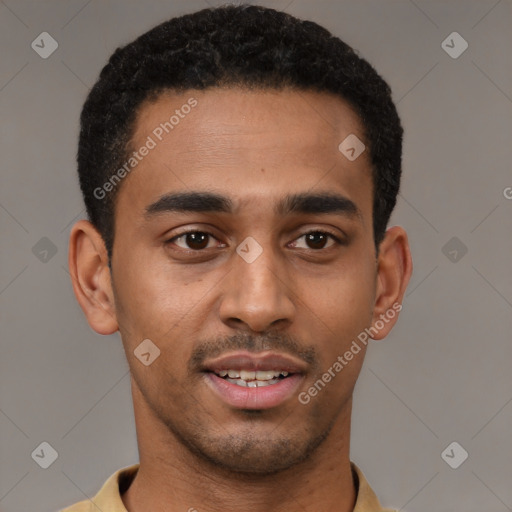 Joyful black young-adult male with short  brown hair and brown eyes