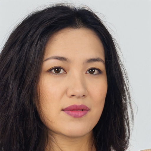 Joyful asian young-adult female with long  brown hair and brown eyes