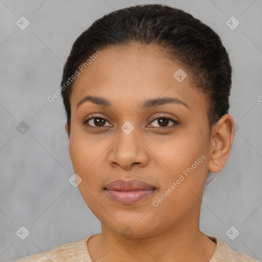 Joyful black young-adult female with short  brown hair and brown eyes