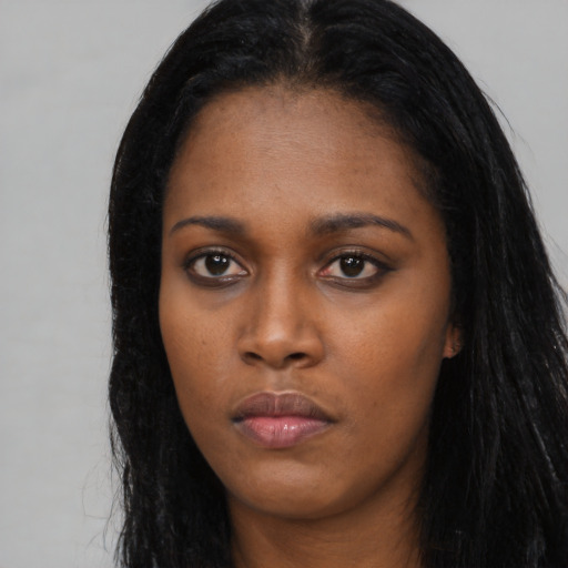 Neutral black young-adult female with long  black hair and brown eyes