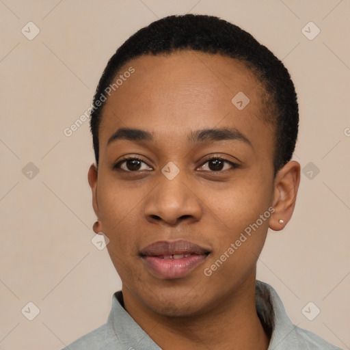 Joyful black young-adult female with short  black hair and brown eyes