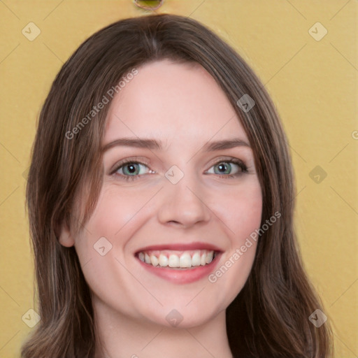 Joyful white young-adult female with long  brown hair and green eyes