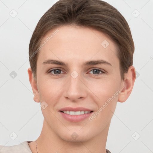 Joyful white young-adult female with short  brown hair and grey eyes