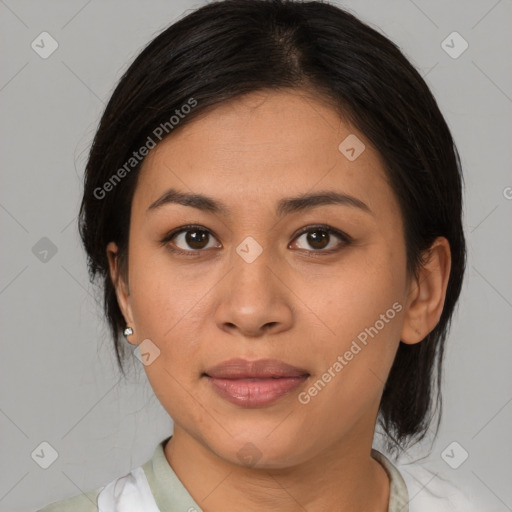 Joyful latino young-adult female with medium  brown hair and brown eyes