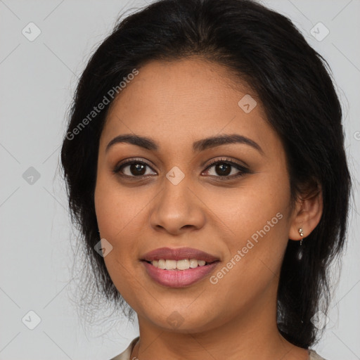 Joyful latino young-adult female with long  brown hair and brown eyes