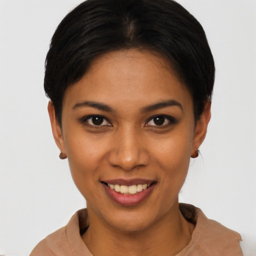 Joyful latino young-adult female with short  brown hair and brown eyes