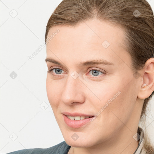 Joyful white young-adult female with medium  brown hair and blue eyes