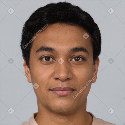 Joyful latino young-adult male with short  black hair and brown eyes