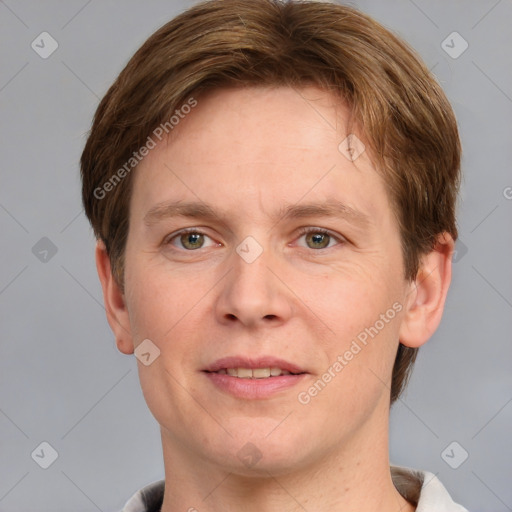 Joyful white adult male with short  brown hair and grey eyes