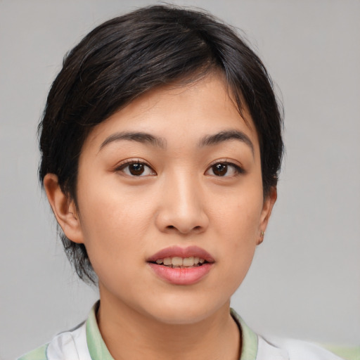 Joyful white young-adult female with medium  black hair and brown eyes
