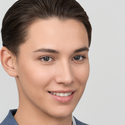 Joyful white young-adult female with short  brown hair and brown eyes