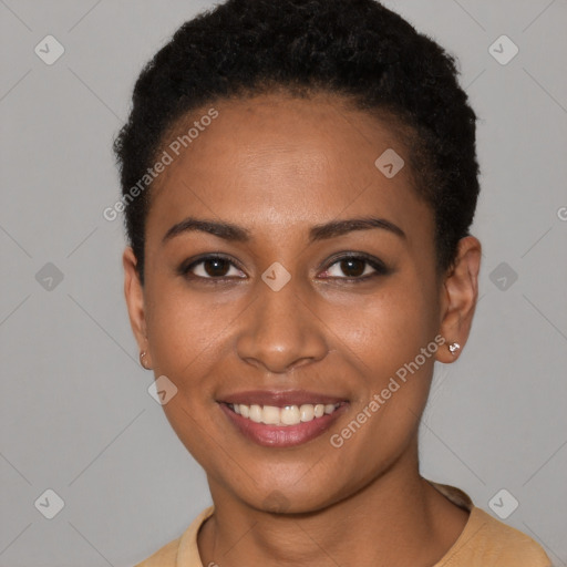 Joyful black young-adult female with short  black hair and brown eyes