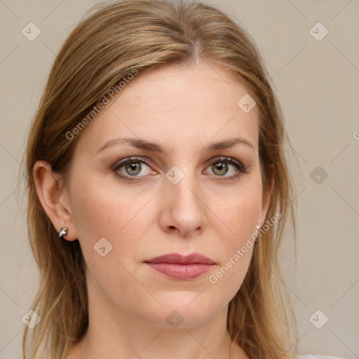 Joyful white young-adult female with long  brown hair and green eyes