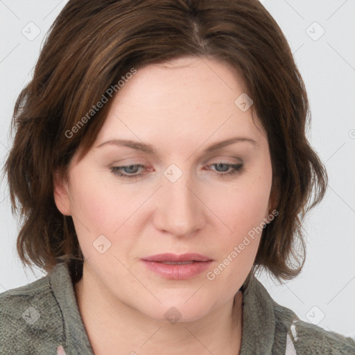 Joyful white young-adult female with medium  brown hair and blue eyes