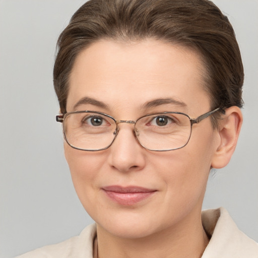 Joyful white adult female with short  brown hair and brown eyes