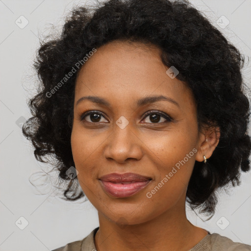 Joyful black adult female with medium  black hair and brown eyes