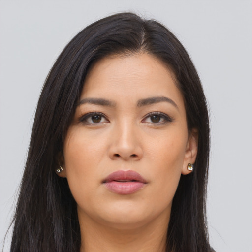Joyful asian young-adult female with long  brown hair and brown eyes