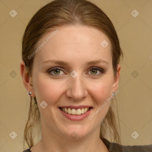 Joyful white young-adult female with medium  brown hair and green eyes