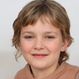 Joyful white child female with medium  brown hair and brown eyes