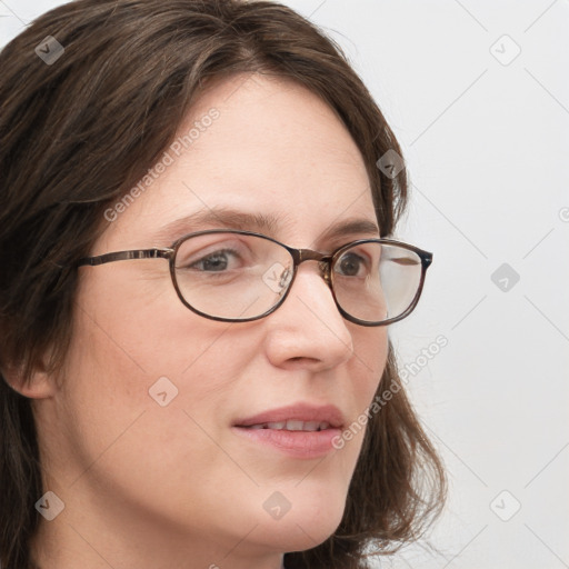 Joyful white young-adult female with long  brown hair and blue eyes