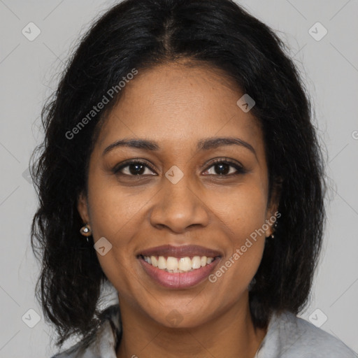 Joyful black young-adult female with medium  brown hair and brown eyes