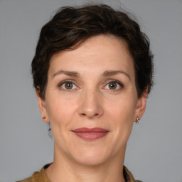 Joyful white adult female with short  brown hair and brown eyes