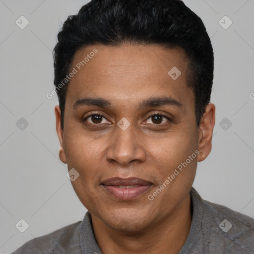 Joyful latino adult male with short  black hair and brown eyes