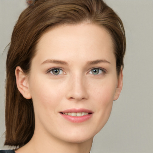 Joyful white young-adult female with long  brown hair and grey eyes