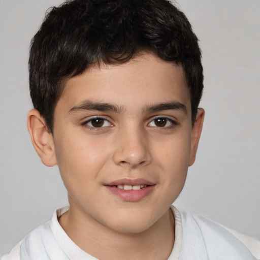 Joyful white child male with short  brown hair and brown eyes