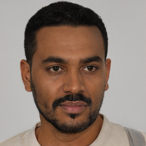 Neutral black young-adult male with short  black hair and brown eyes