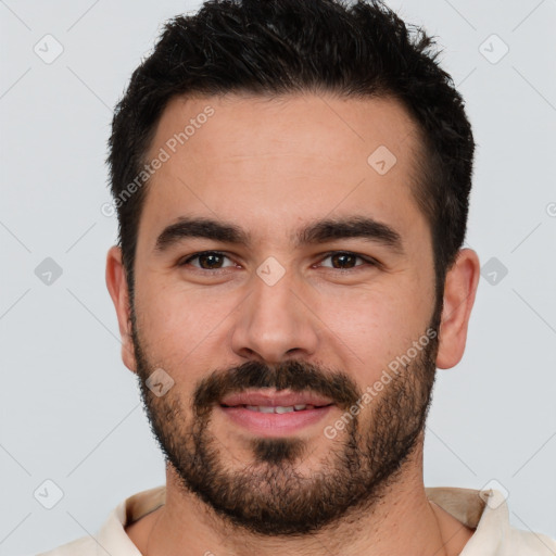 Joyful white young-adult male with short  black hair and brown eyes