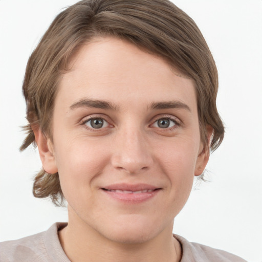 Joyful white young-adult female with short  brown hair and grey eyes