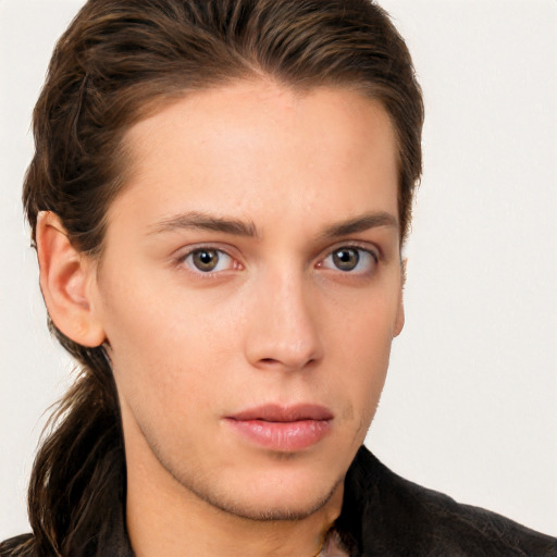 Neutral white young-adult male with long  brown hair and brown eyes