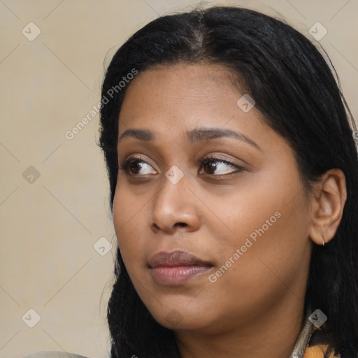 Joyful latino young-adult female with long  black hair and brown eyes