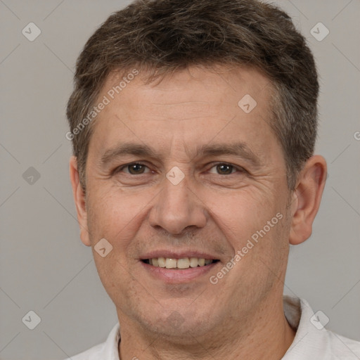 Joyful white adult male with short  brown hair and brown eyes