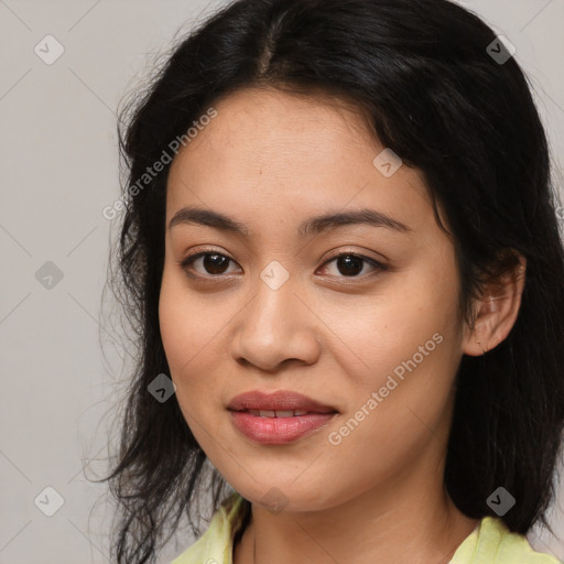 Joyful latino young-adult female with medium  brown hair and brown eyes