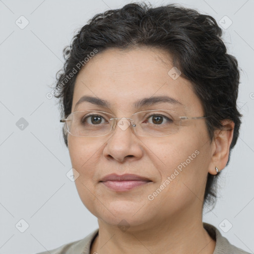 Joyful white adult female with short  brown hair and brown eyes