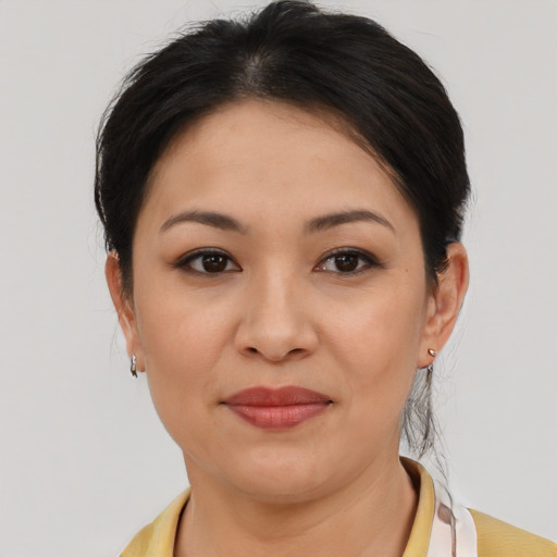 Joyful asian young-adult female with medium  brown hair and brown eyes
