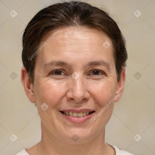 Joyful white adult female with short  brown hair and brown eyes