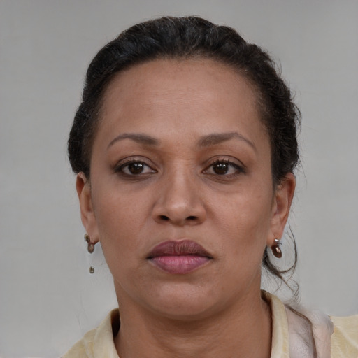 Neutral latino adult female with short  brown hair and brown eyes