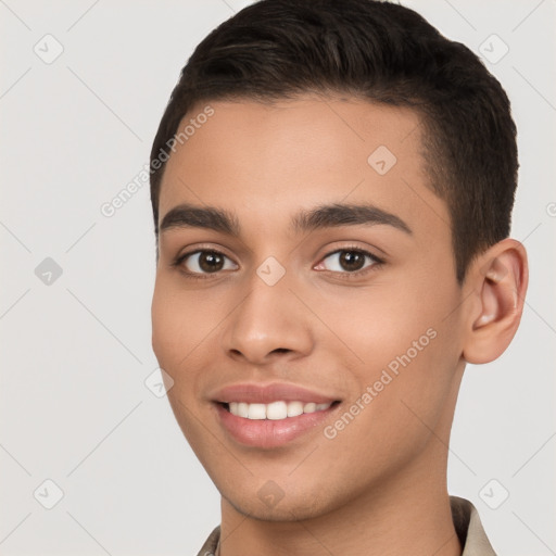 Joyful white young-adult male with short  brown hair and brown eyes